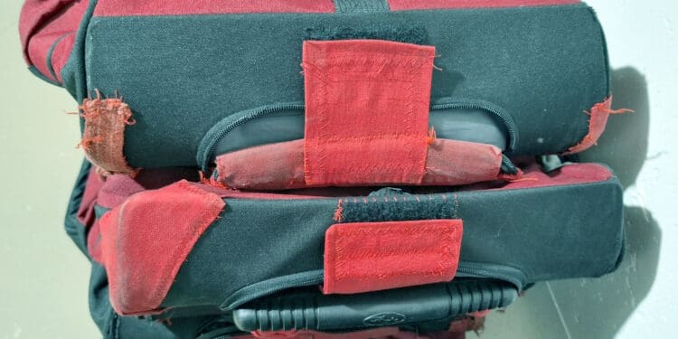 a close up of a red and black bag
