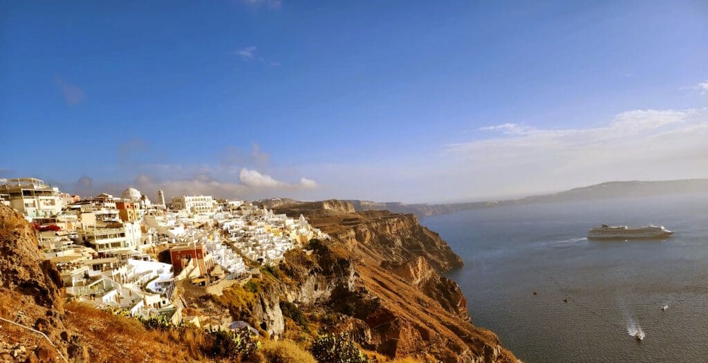 a city on a cliff by the ocean