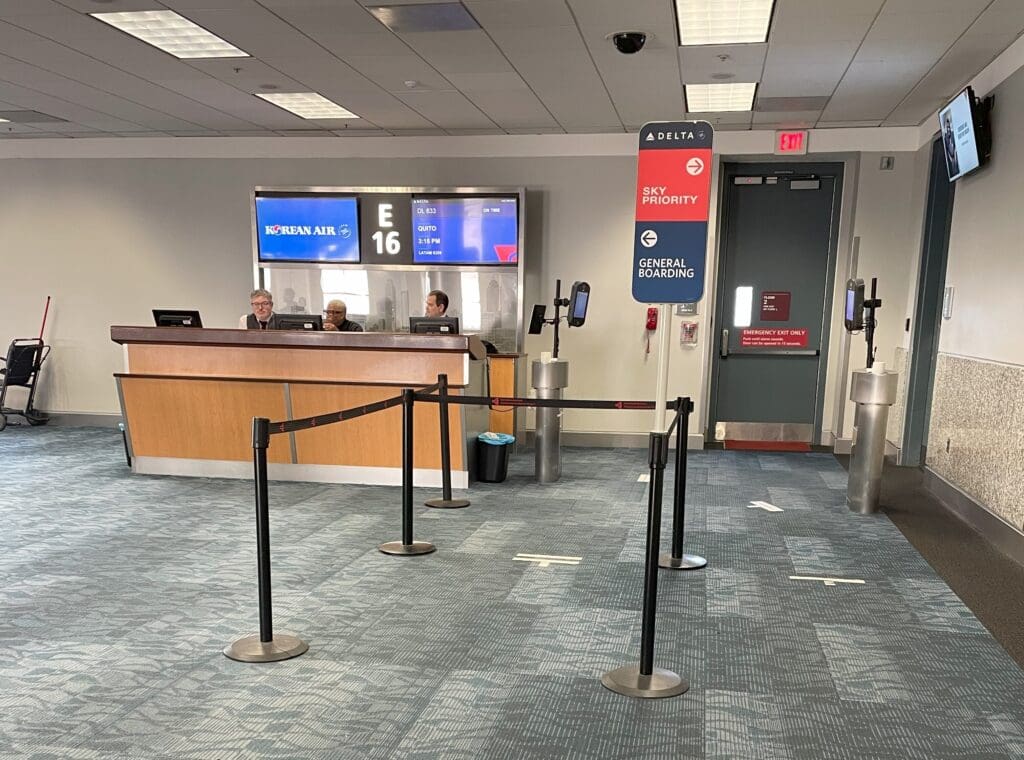 a line of black poles in a airport