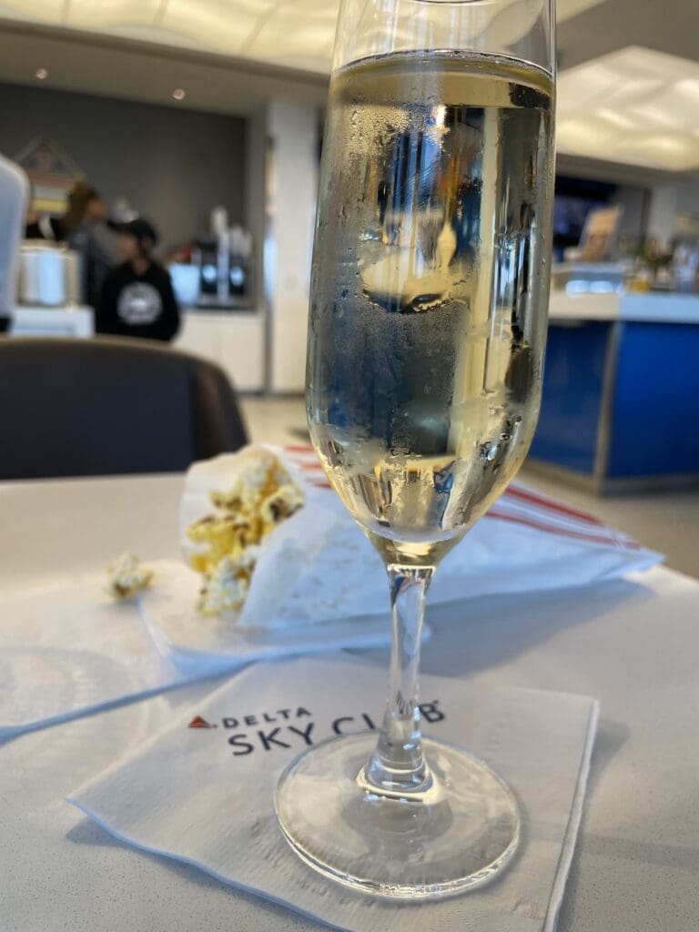 a glass of champagne on a table