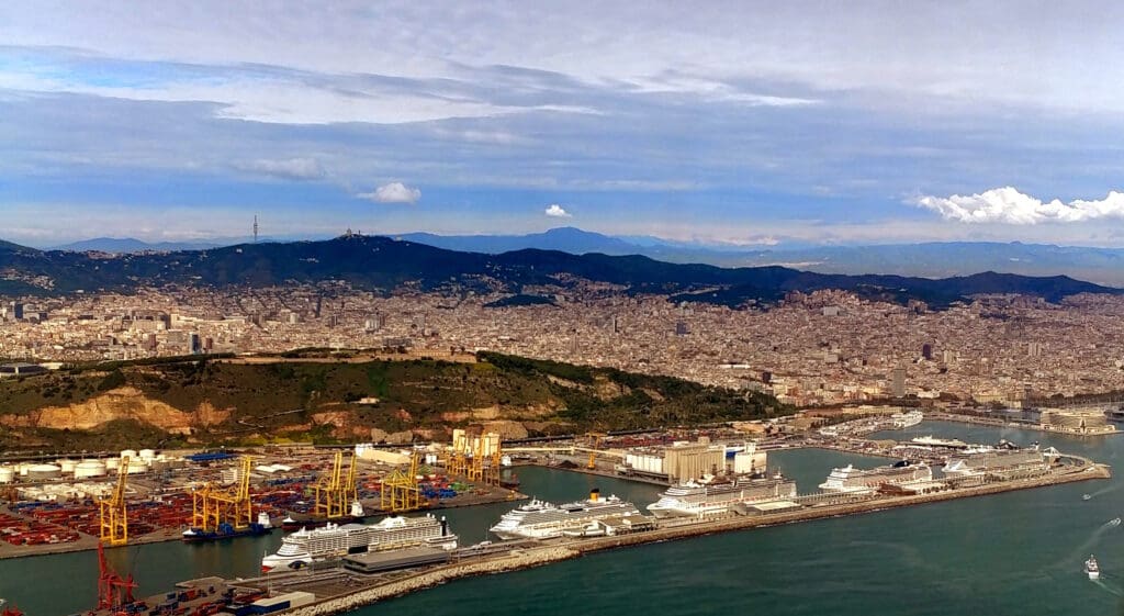 a large city with many ships and a body of water