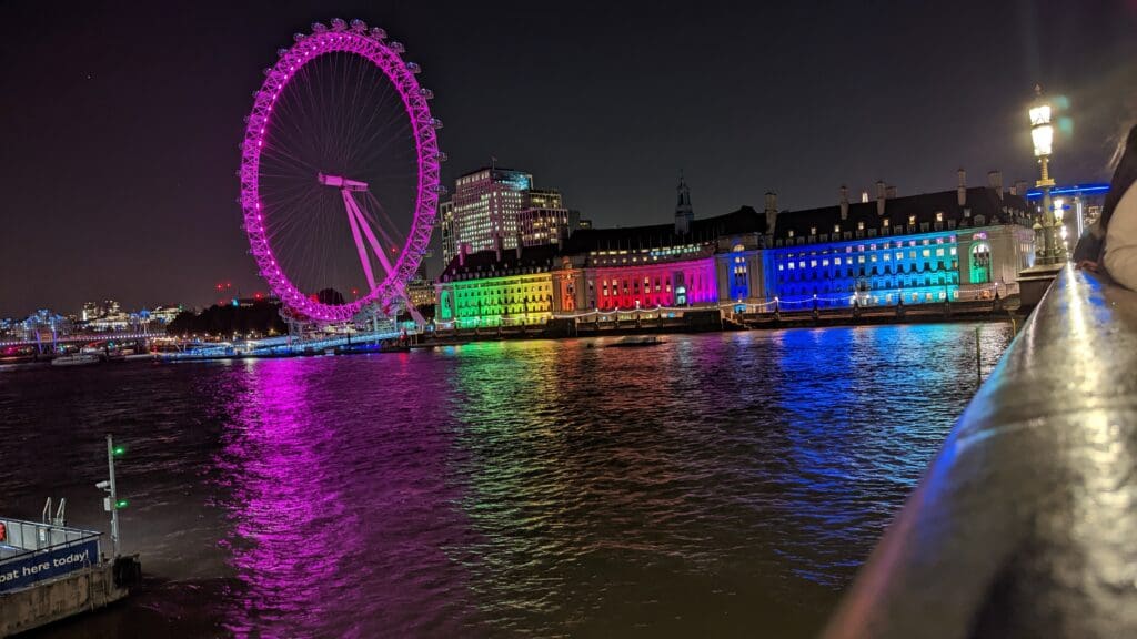 a large ferris wheel lit up at night