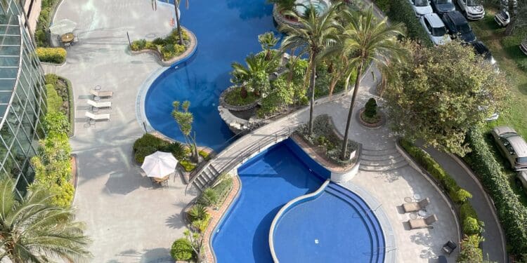 a swimming pool and parking lot