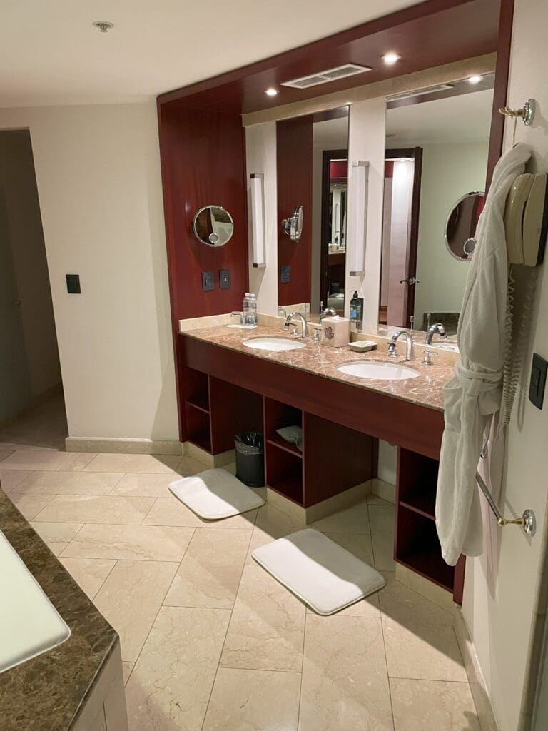 a bathroom with a large mirror and sinks