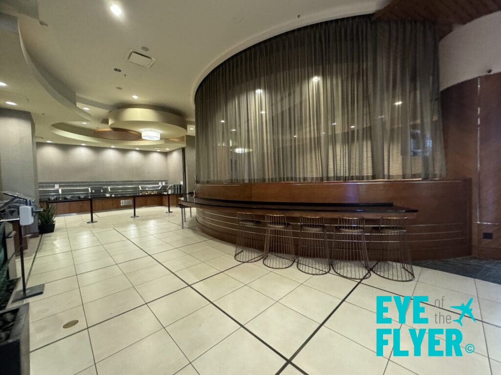 a room with a curtained wall and stools atbSpringHill Suites Las Vegas Convention Center rooftop deck (© Eye of the Flyer)