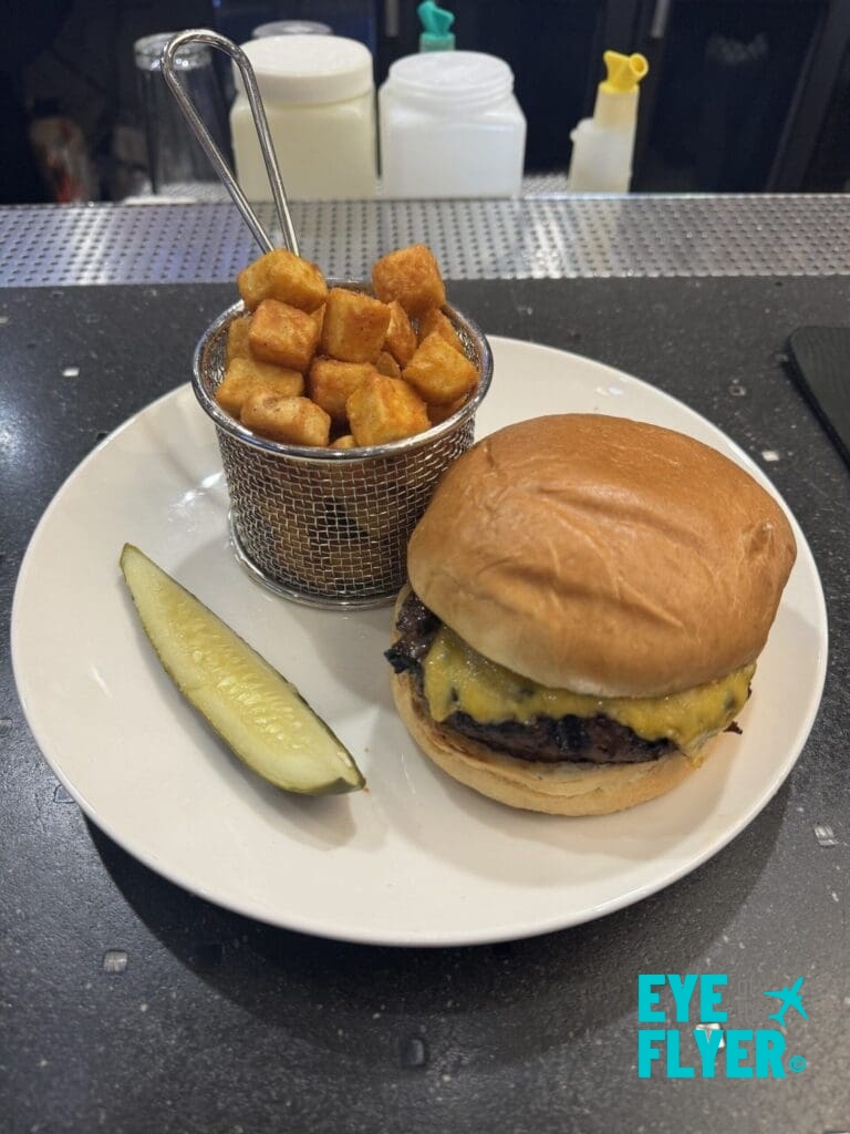 a burger and potato wedges on a plate at the SpringHill Suites Las Vegas Convention Center rooftop deck (© Eye of the Flyer)