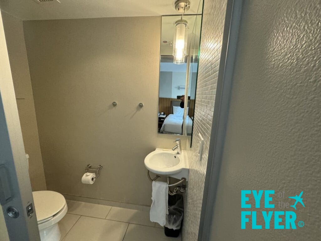 a bathroom with a mirror and sink SpringHill Suites Las Vegas Convention Center (© Eye of the Flyer)