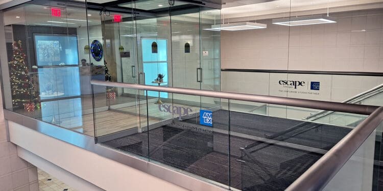 a glass wall with a railing