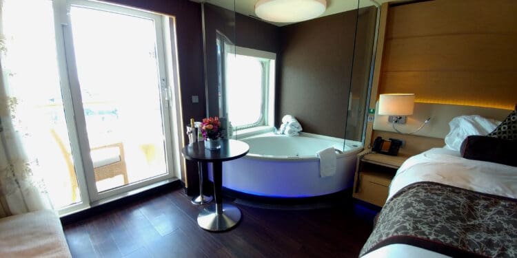 a room with a round tub and a window