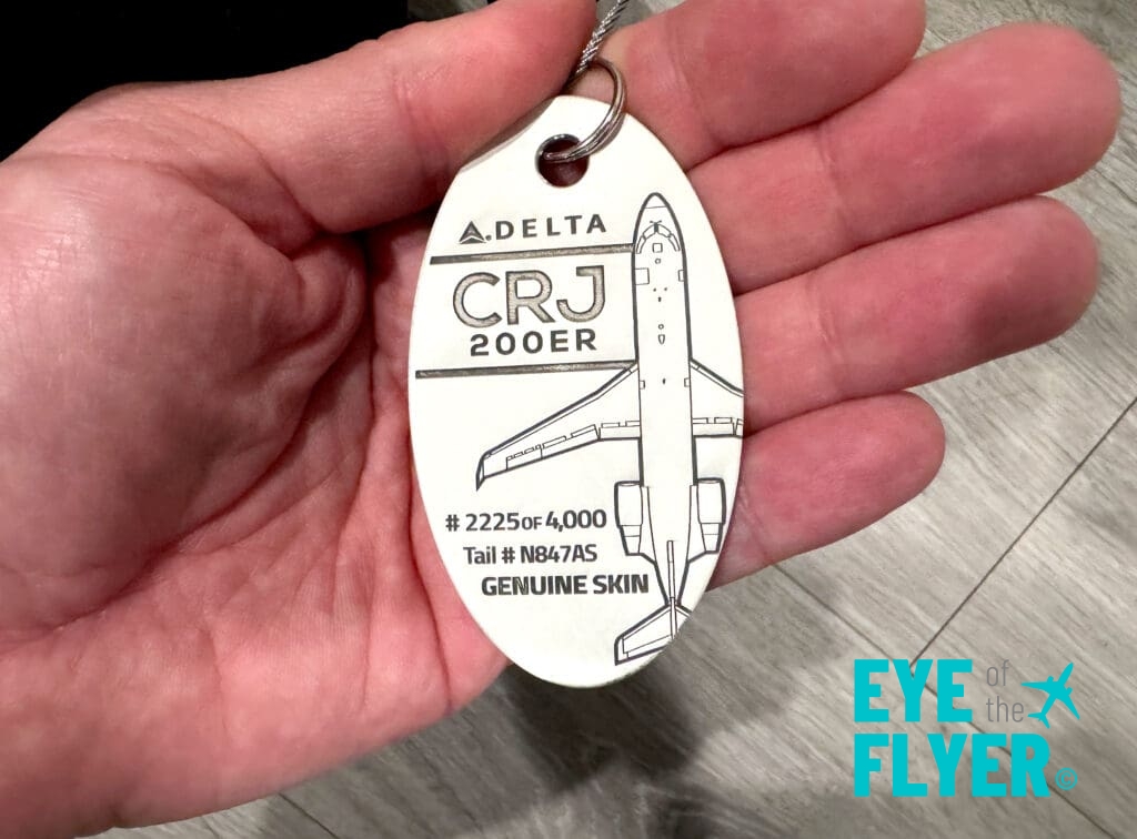 A Plane Tags baggage tag made from a retired Delta Connection CRJ-200.