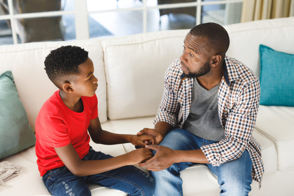 "Bad news. Our father-son trip to the NFL game got moved to a Thursday night. You have school and I couldn't get the day off. And airfares are sky high. Sorry, pal, we can't go." (©iStock.com/Wavebreakmedia)