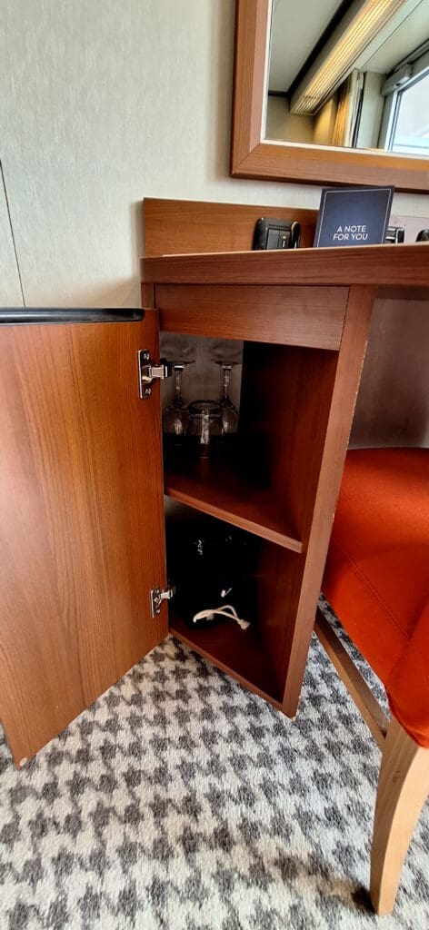 a wine glasses in a corner shelf