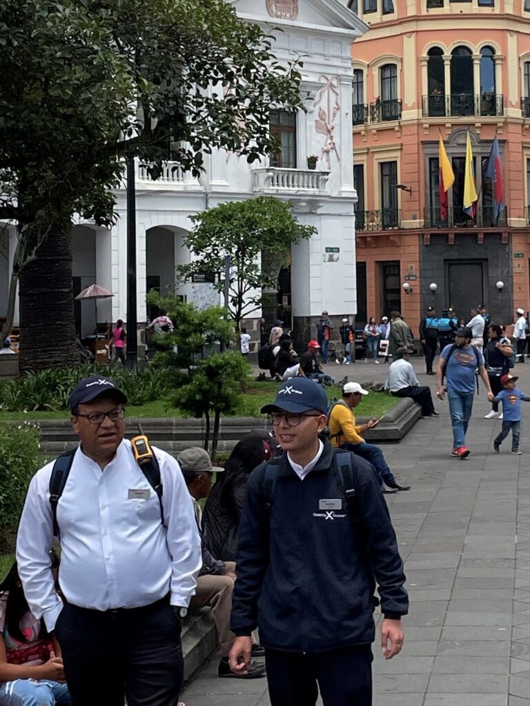 a group of people walking in a city