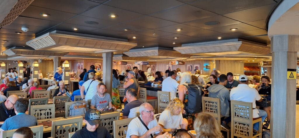 a group of people sitting at tables in a restaurant