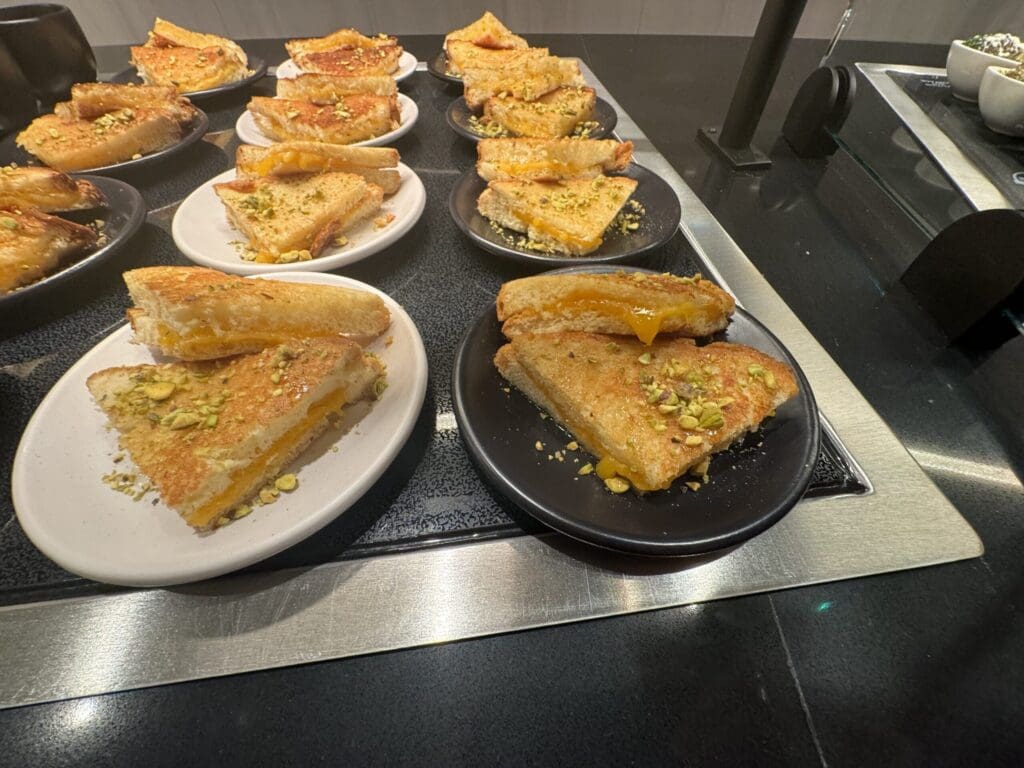 plates of grilled cheese sandwiches on a counter