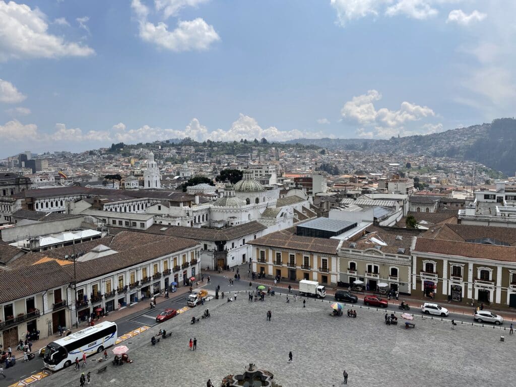 a city with many buildings and a fountain