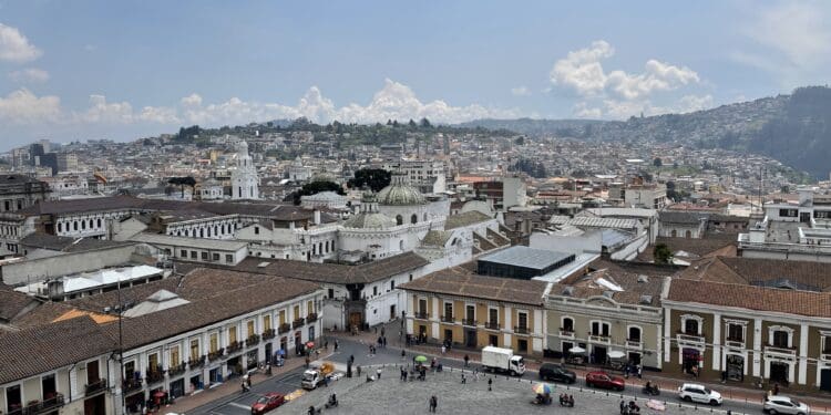 a city with many buildings and a fountain