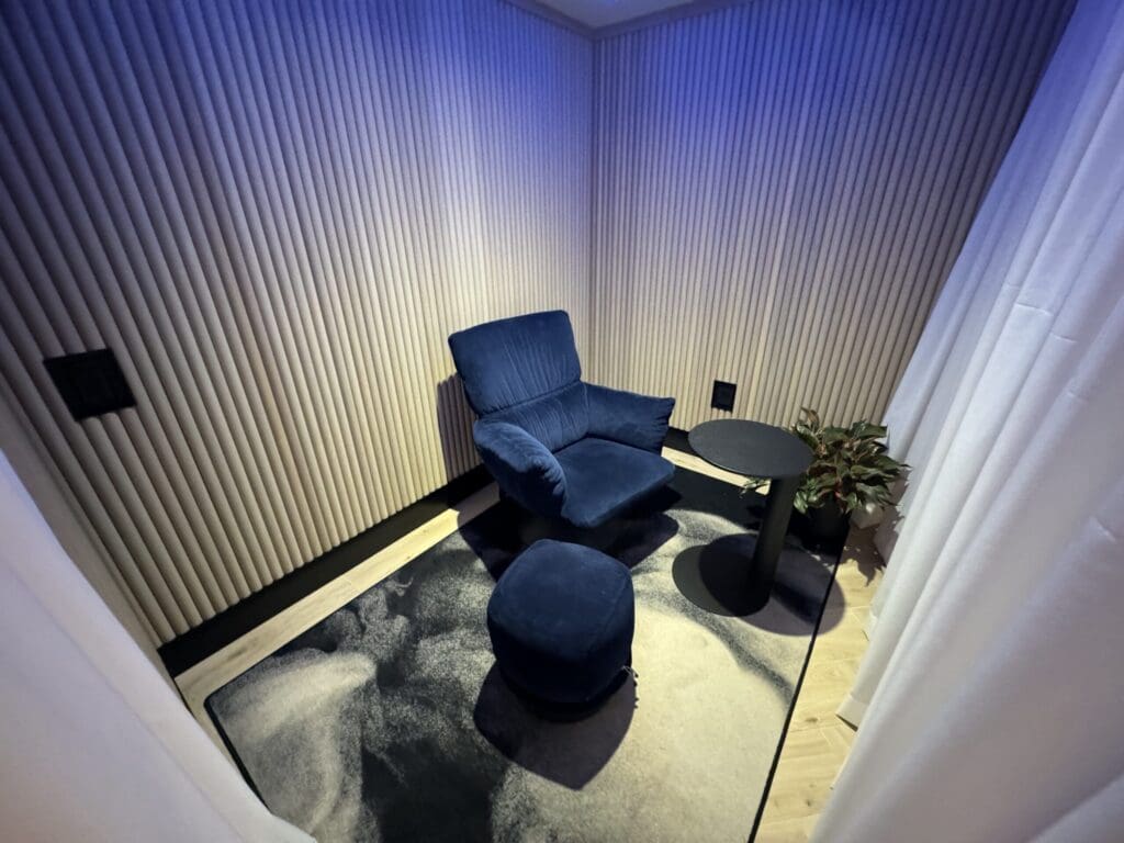 a chair and ottoman in a room