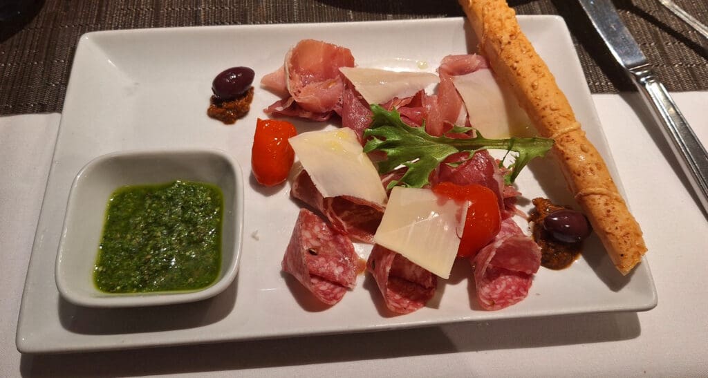 a plate of food with sauce and bread