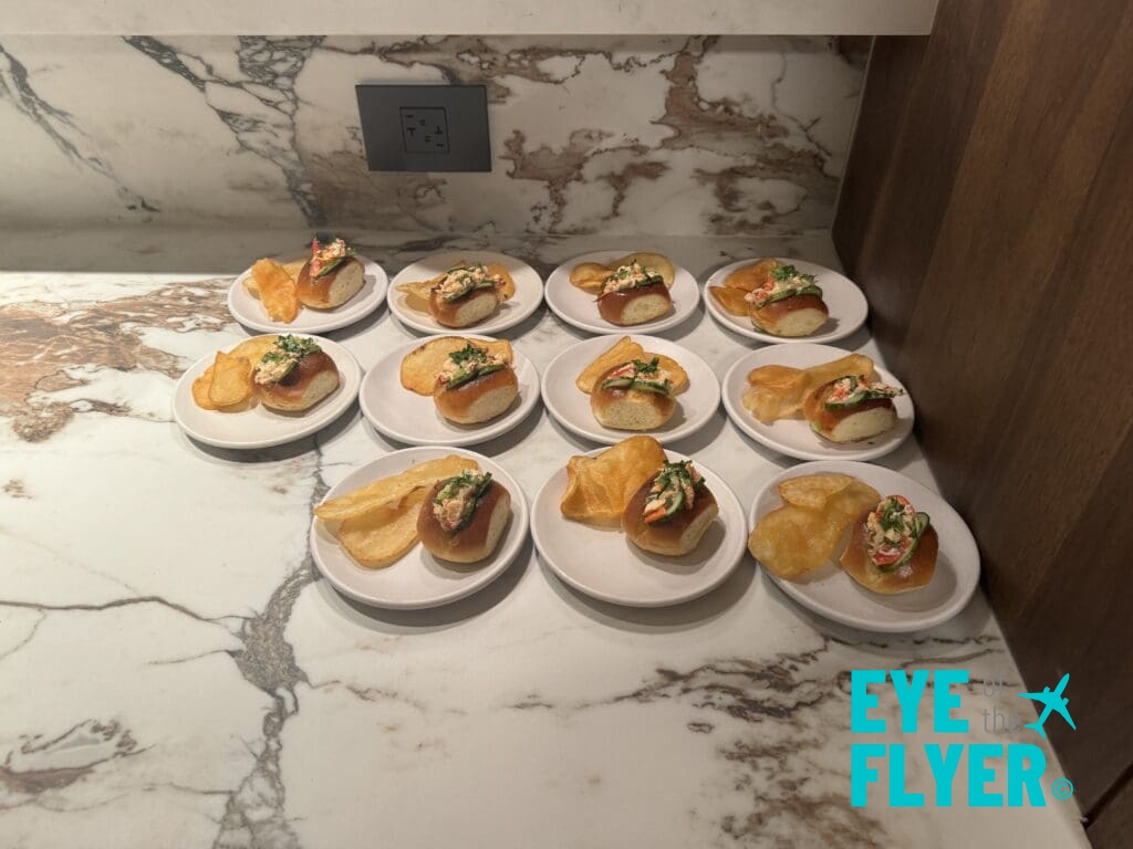 a group of small plates of food on a marble counter
