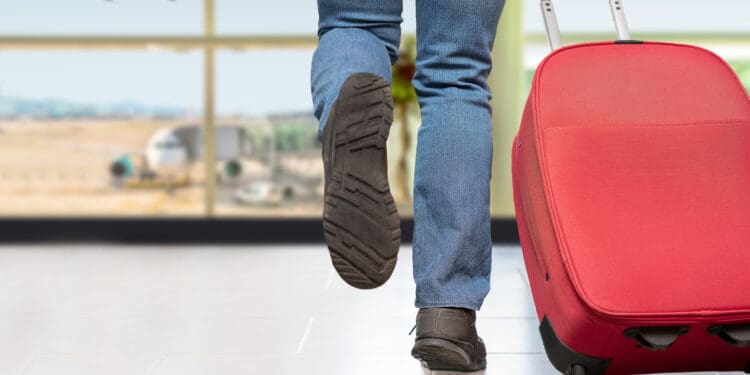a person walking with luggage