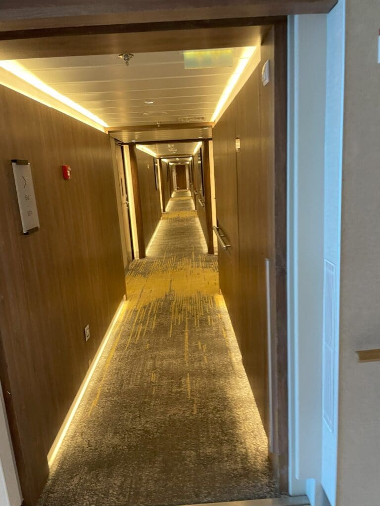 a hallway with lights on the walls