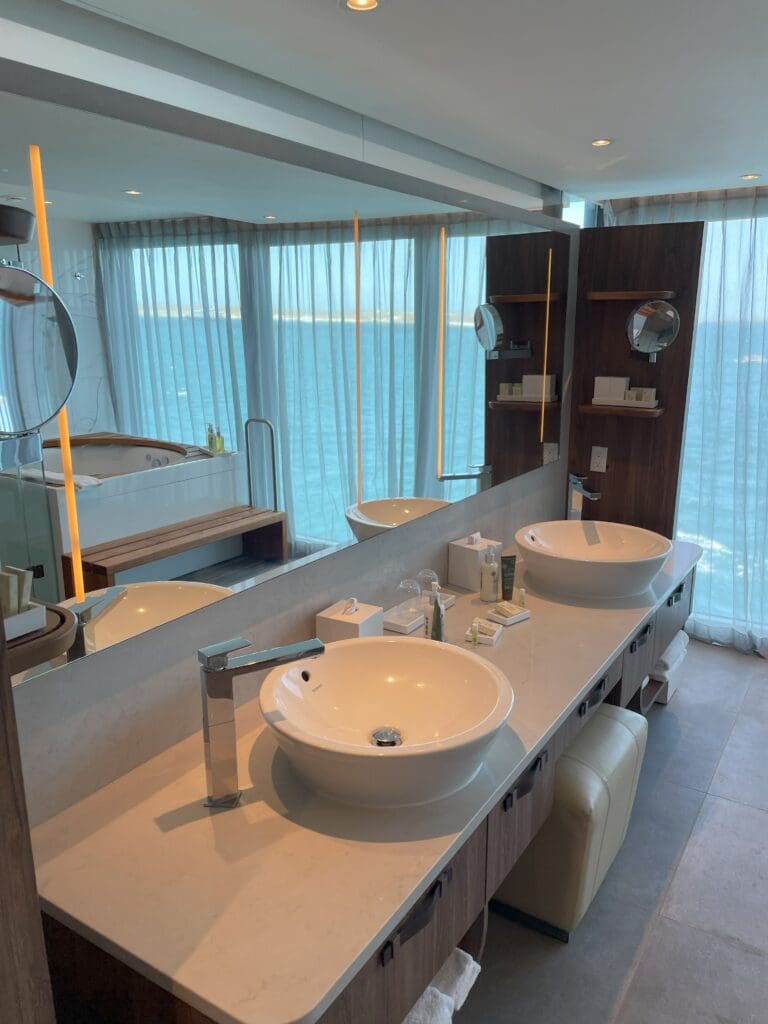 a bathroom with a large mirror and sinks