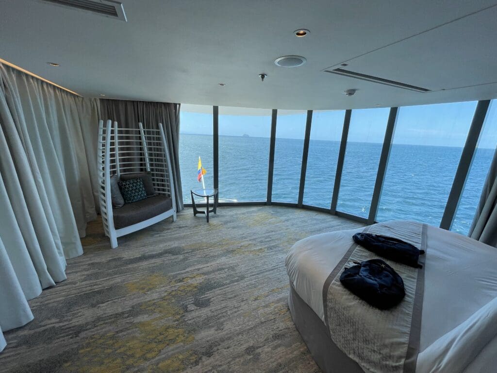 a room with a large window overlooking the ocean