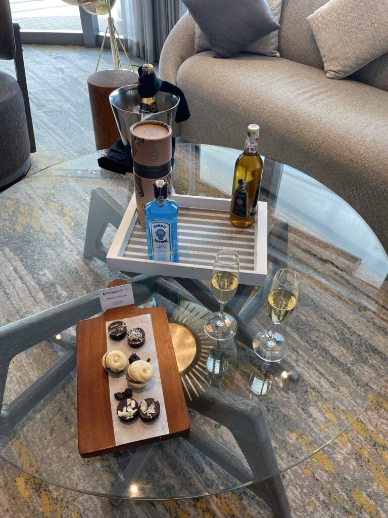 a table with drinks and a tray of food on it