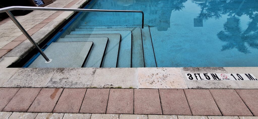 a pool with steps leading to the side