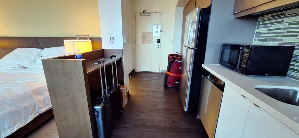 a hallway with luggage on the floor