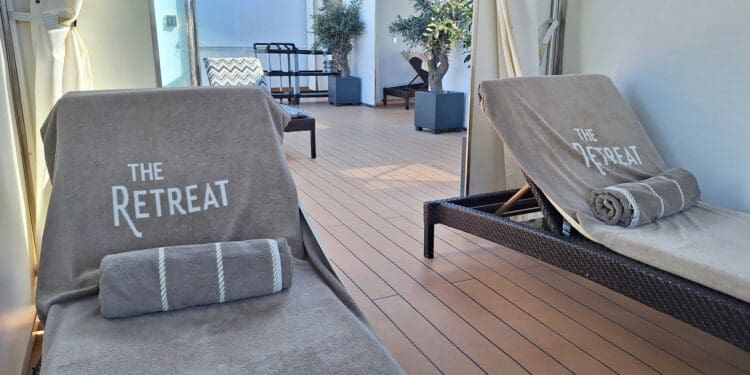 a deck with chairs and a mirror