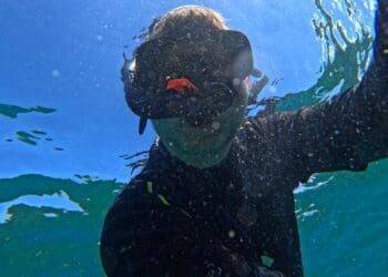 a person in a scuba mask underwater
