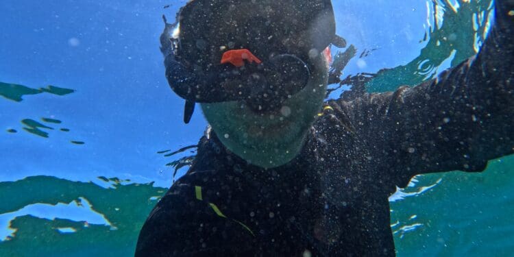 a person in a scuba mask underwater