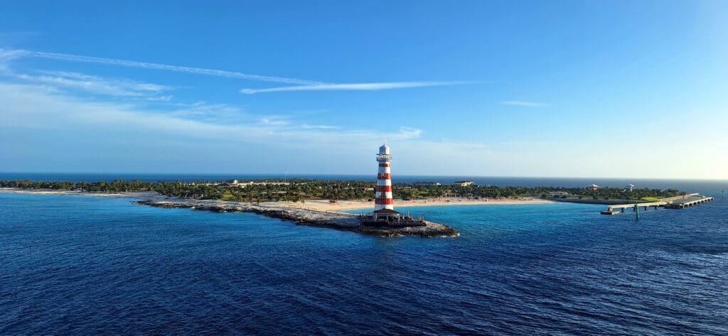 a lighthouse on a small island in the ocean