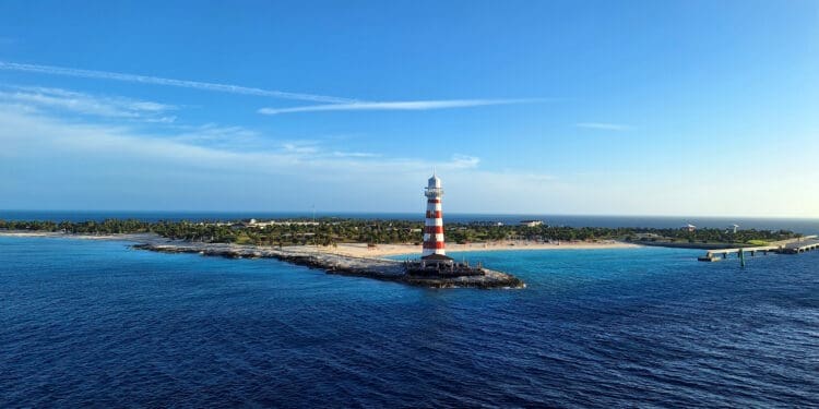 a lighthouse on a small island in the ocean