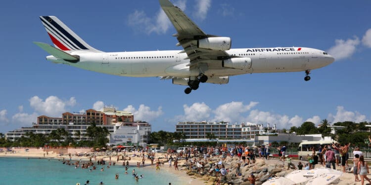 Sint Maarten, Netherlands Antilles - September 15, 2016: An Air France Airbus A340-300 with the registration F-GLZP approaching Sint Maarten Airport (SXM). Sint Maarten is rated one of the most dangerous airports in the world. Air France is the French flag carrier, headquartered in Paris.