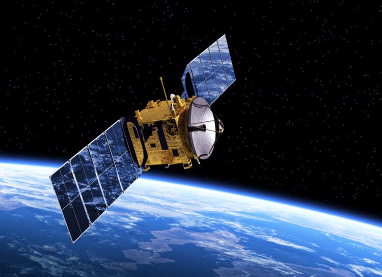 a satellite in space above Communication Satellite Orbiting Earth. 3D Scene.