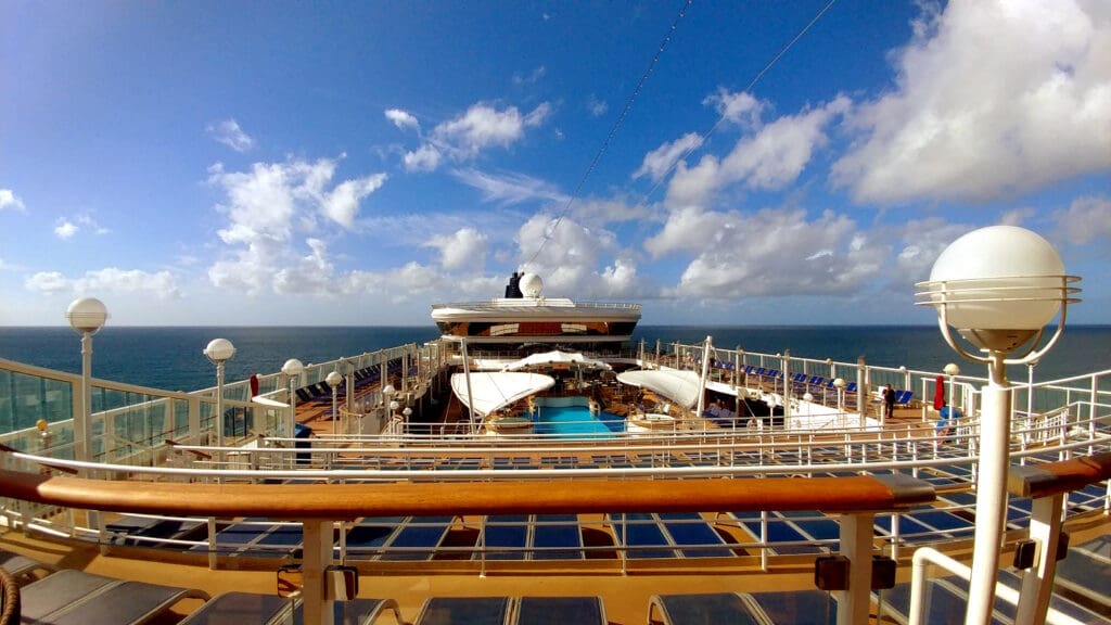 a cruise ship with a pool in the ocean