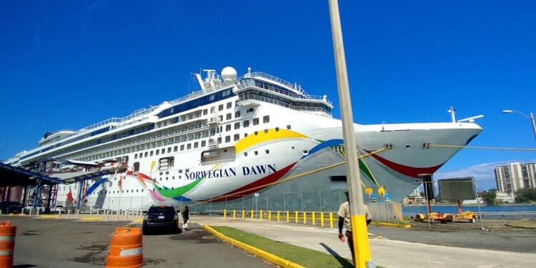 a cruise ship docked at a dock