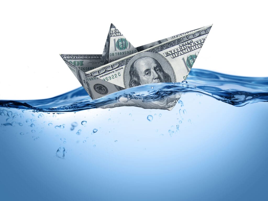 a paper boat made out of money