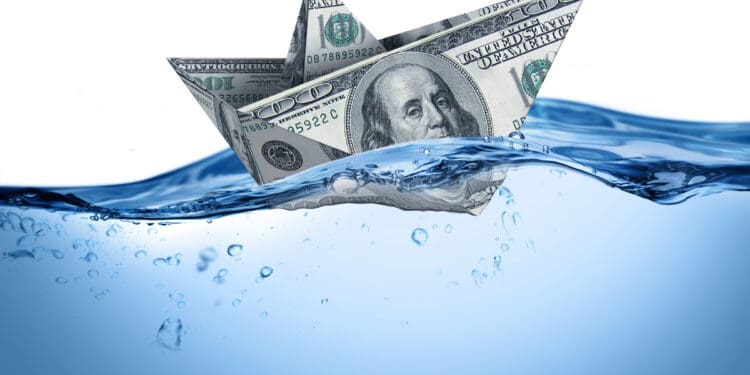 a paper boat made out of money