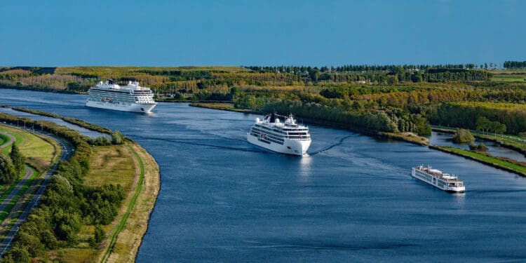 a group of cruise ships on a river