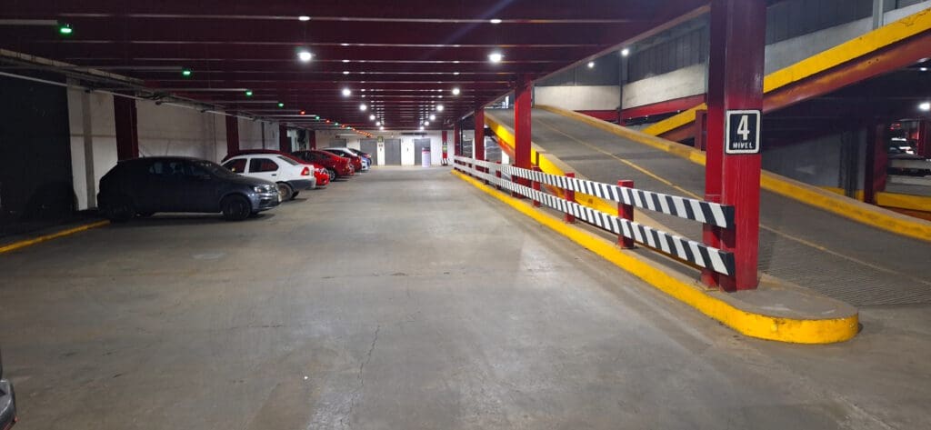 a parking garage with a lot of cars