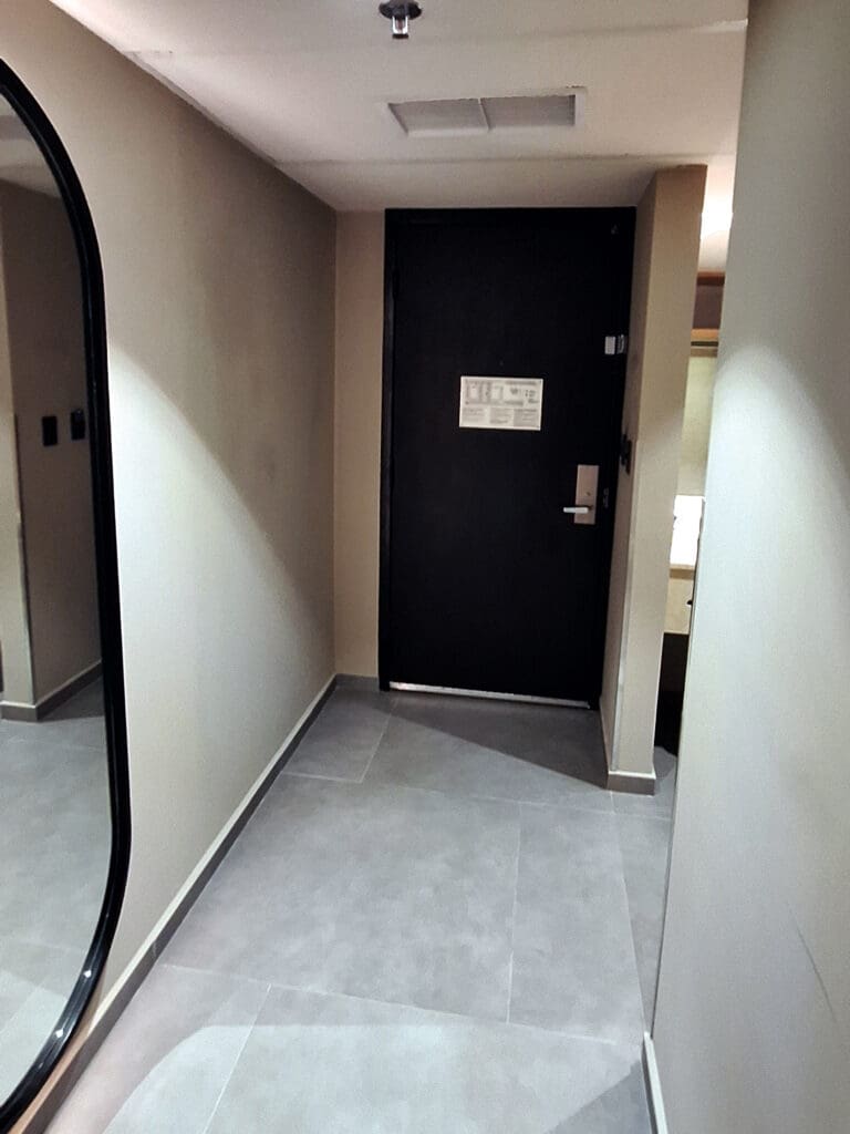 a black door in a hallway
