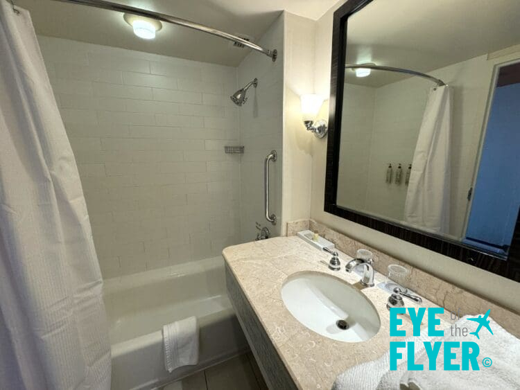 a bathroom with a mirror and sink