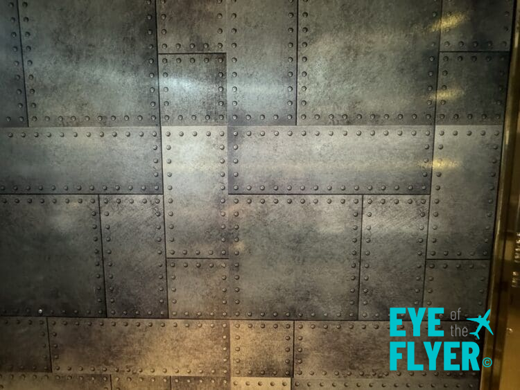 a metal wall with rivets