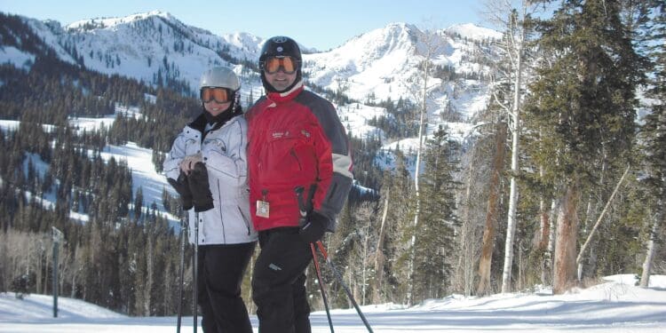 a man and woman on skis