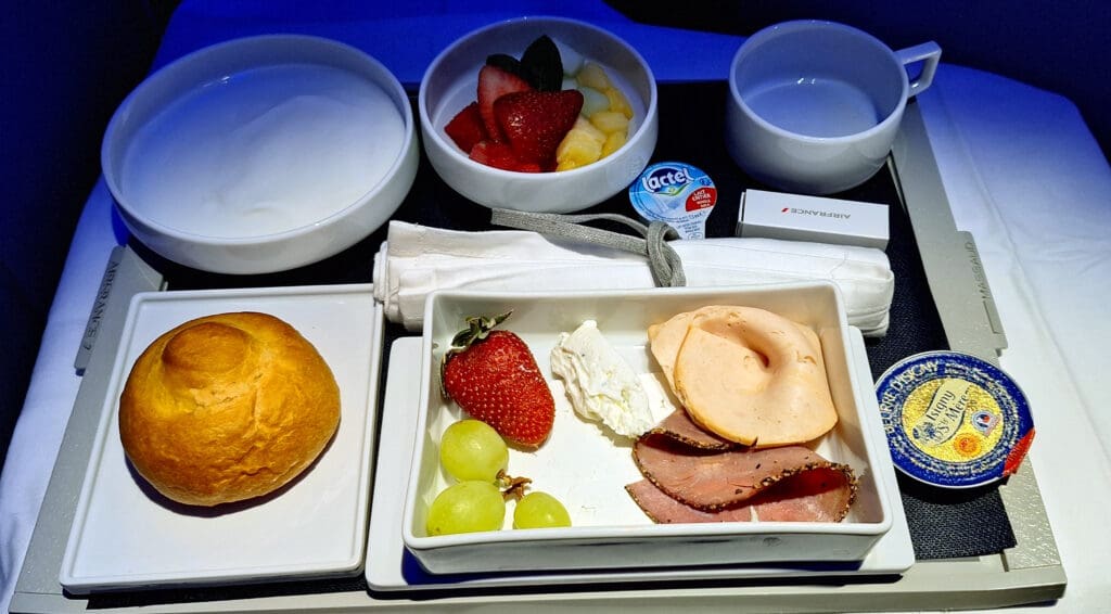 a tray of food and fruit on a tray