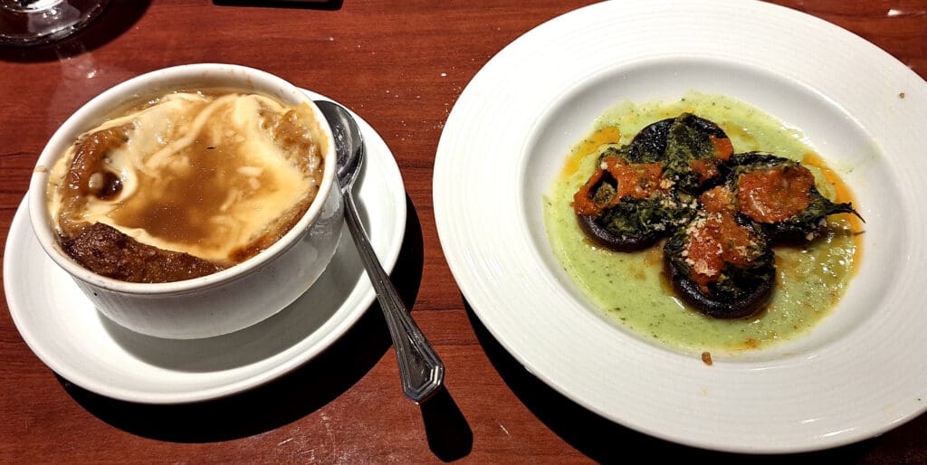 a plate of food and a spoon on a table